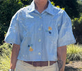Short sleeve blue linen top with floral applique